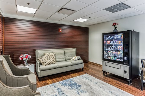 a living room with a couch and a vending machine