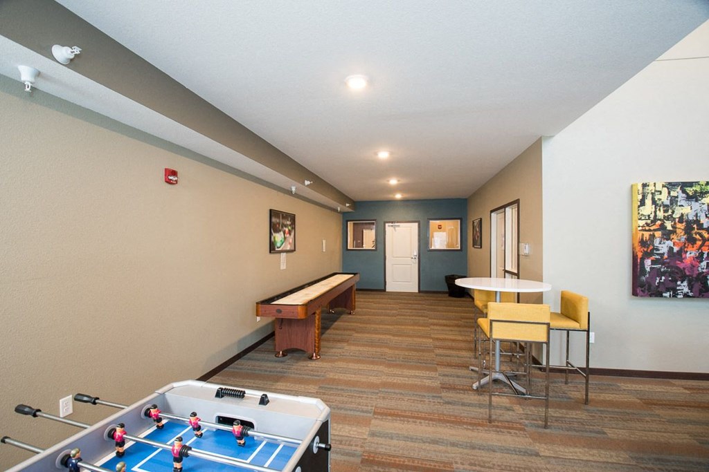 a games room with a pool table and a ping pong table