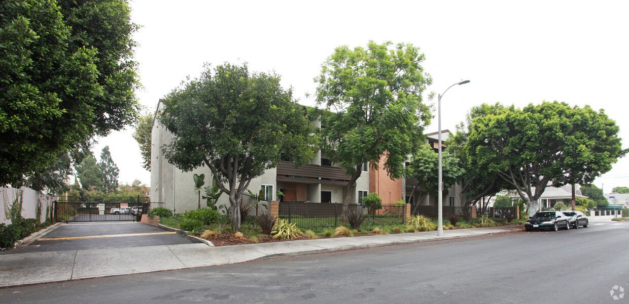 a city street with a car parked in front of a building