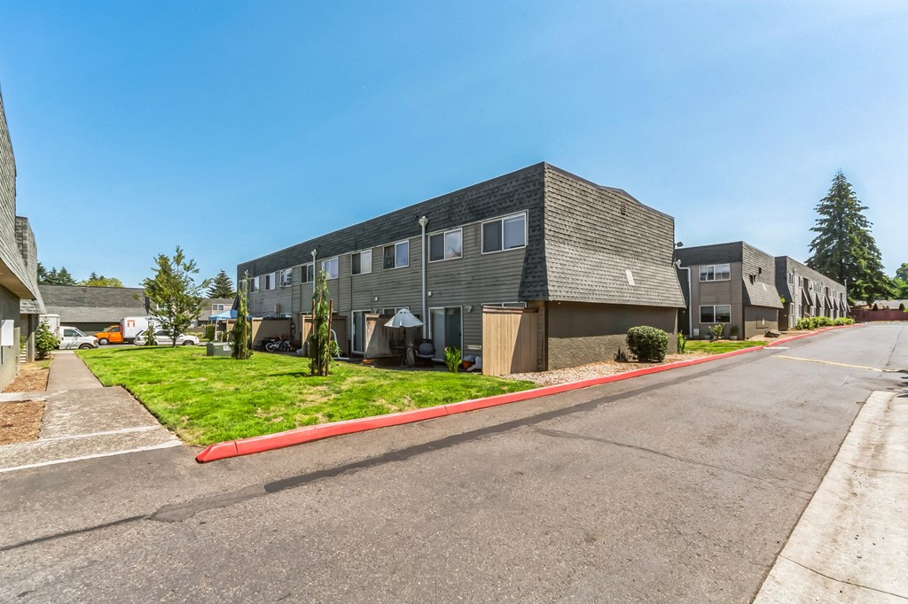 our apartments are located on the corner of a city street