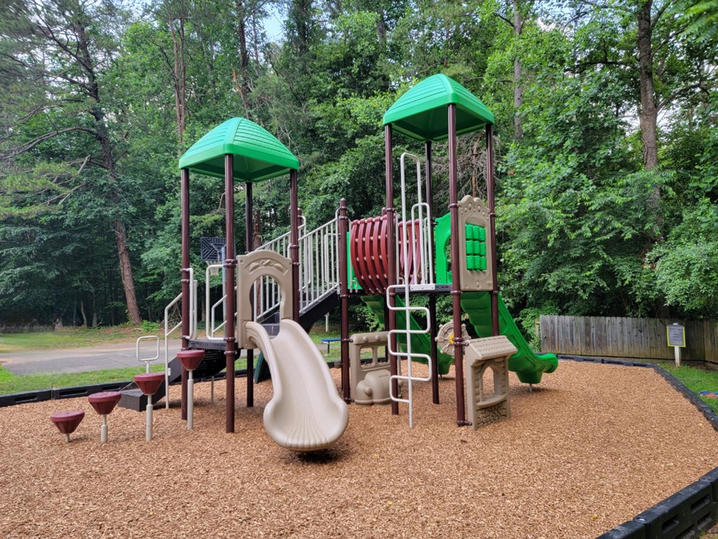 a playground with a slide and other playground equipment