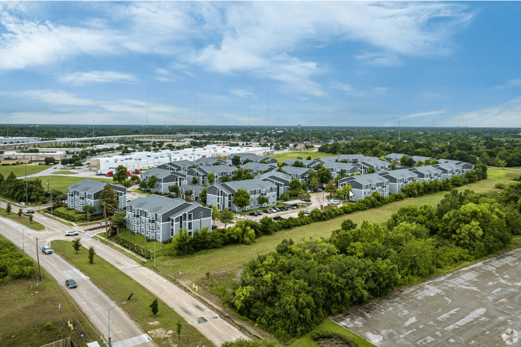 arial view of a subdivision with green grass and trees