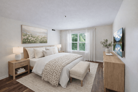 A bedroom with a large bed, a bench, and a painting on the wall.