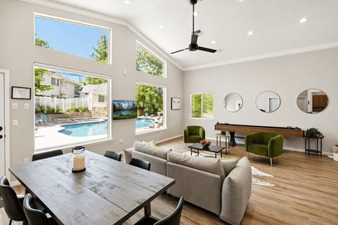 A modern living room with a pool view.