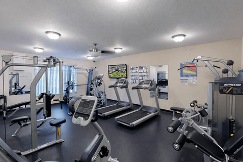 Fitness center with cardio and strength equipment at The Ponds at Heritage Place Apartments, Sartell, 56377
