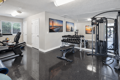 Fitness center with cardio and strength equipment at Crestview Huntington Apartments, North Carolina