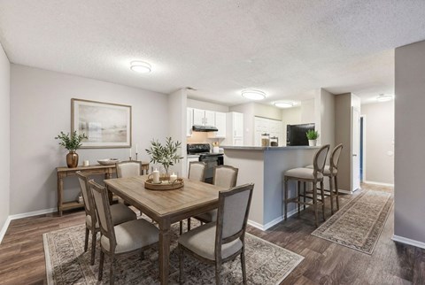 Open concept dining area with kitchen view at Delta Crossing Apartments, North Carolina, 28212