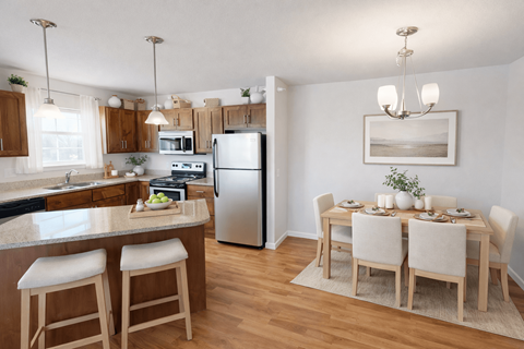 A kitchen with a table set for four.