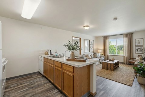A kitchen with wooden cabinets and a white countertop.