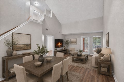 A modern dining room with a wooden table and chairs.