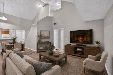 A cozy living room with a fireplace and comfortable seating.
