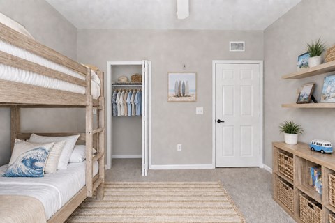 A bedroom with a bunk bed and a toy truck on the shelf.
