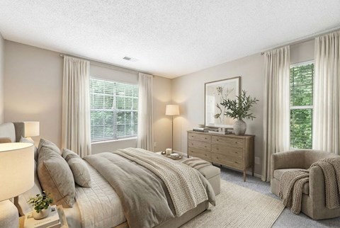 Master bedroom with wood dresser and armchair at Delta Crossing Apartments, North Carolina, 28212