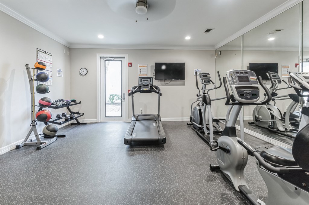 the gym with treadmills and other exercise equipment at the preserve at greatstone