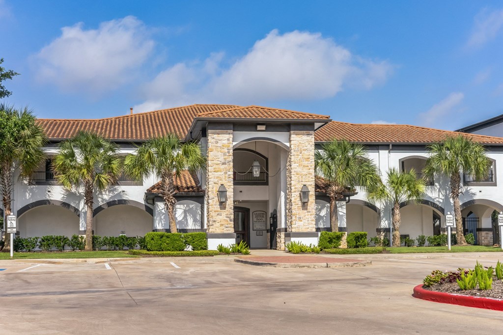 a building with palm trees in front of it