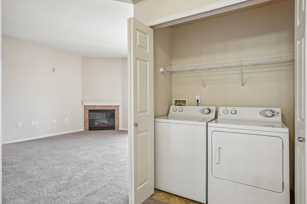 A laundry room with a washer and dryer. at Stetson Meadows Apartments, Colorado Springs, Colorado
