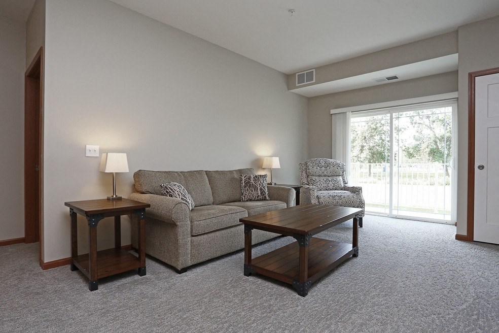 a living room with a couch and two tables