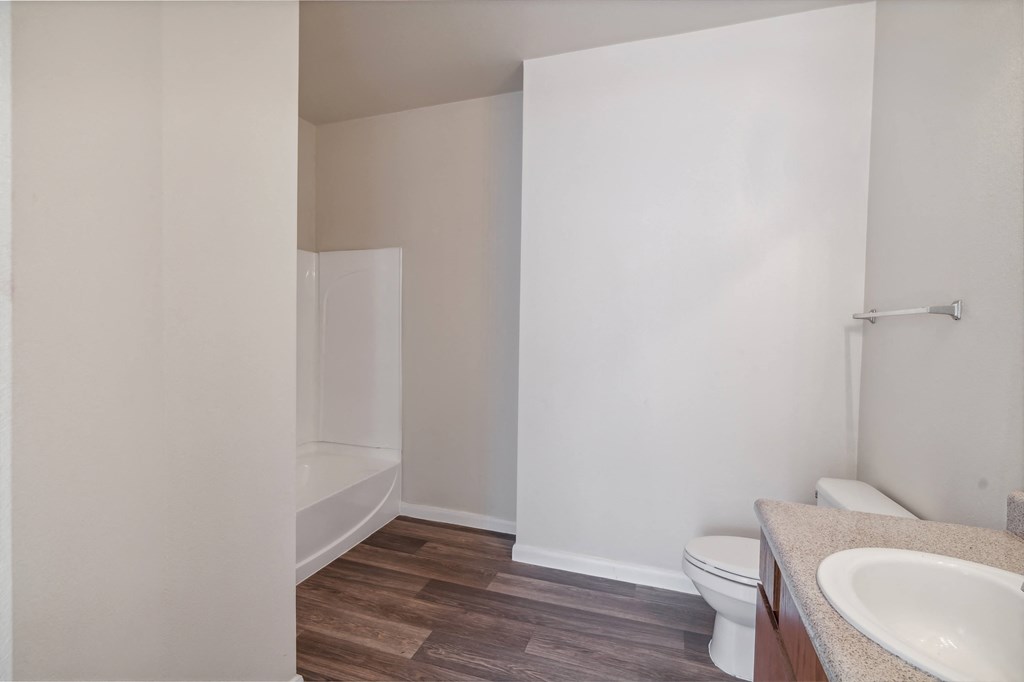 an empty bathroom with a toilet and a sink