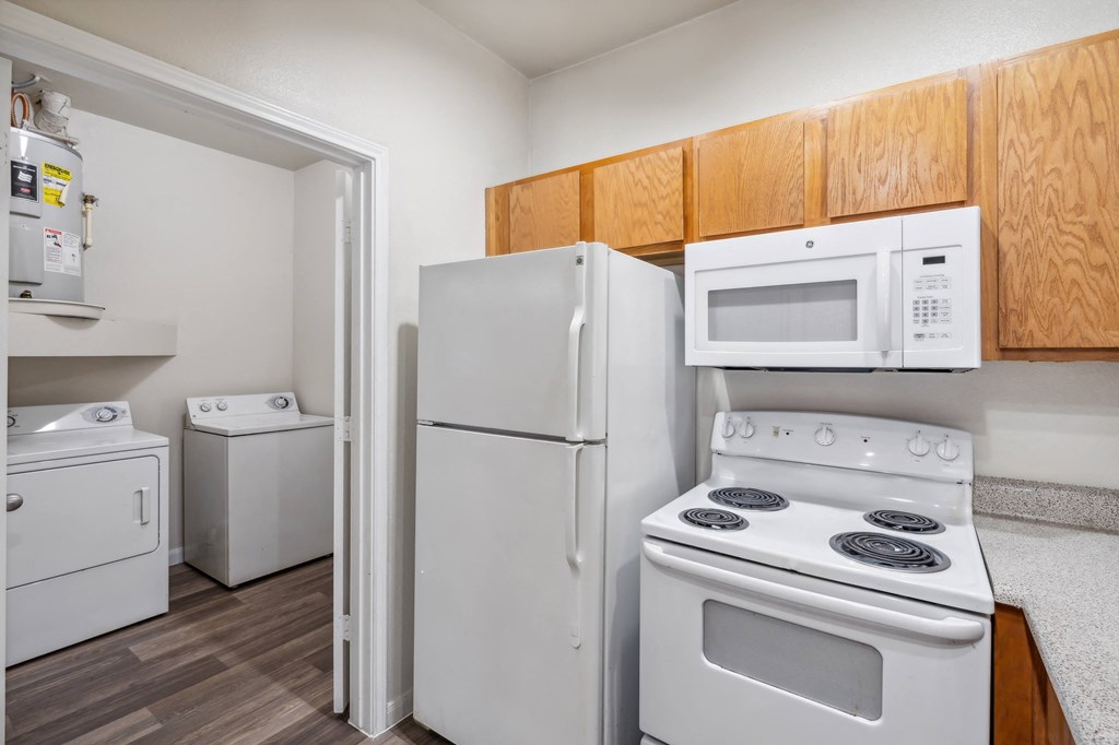 our apartments have a kitchen with a stove refrigerator and microwave