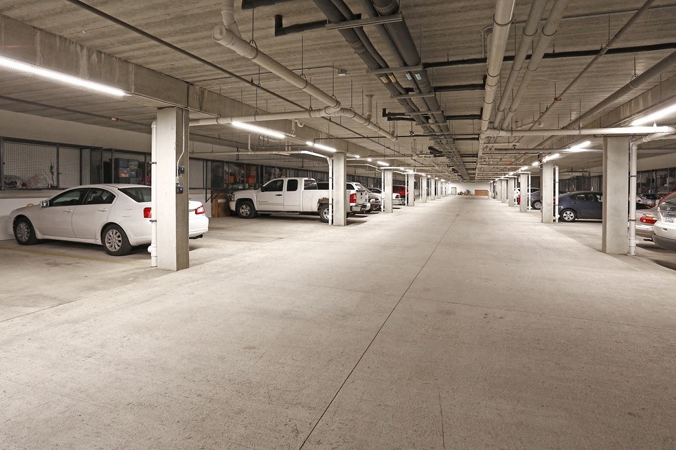 a parking garage with cars parked in it