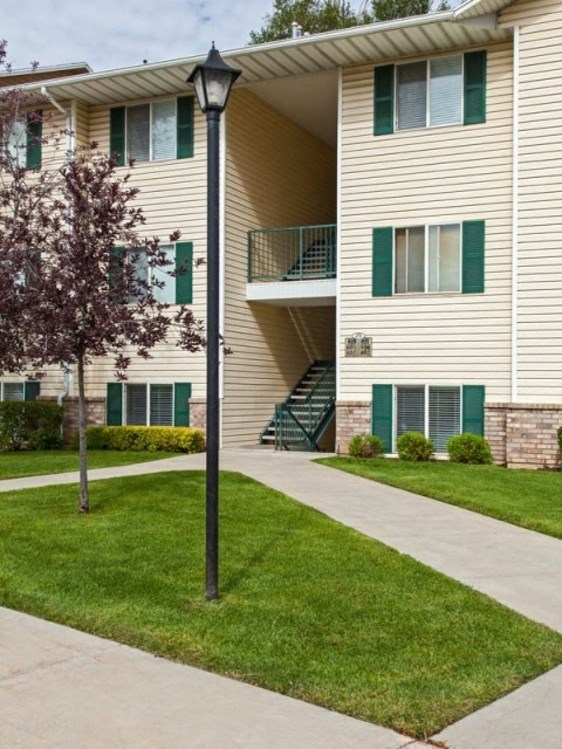 a lamp post in front of an apartment building