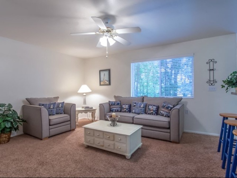 a living room with couches and a coffee table