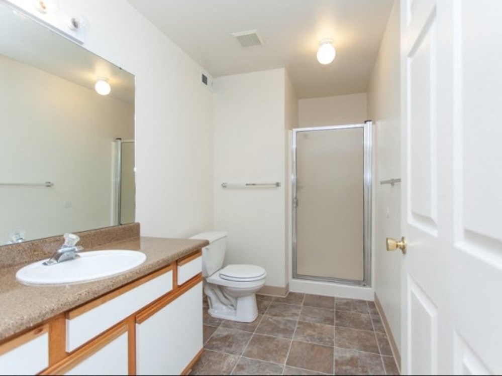 a bathroom with a sink toilet and a shower