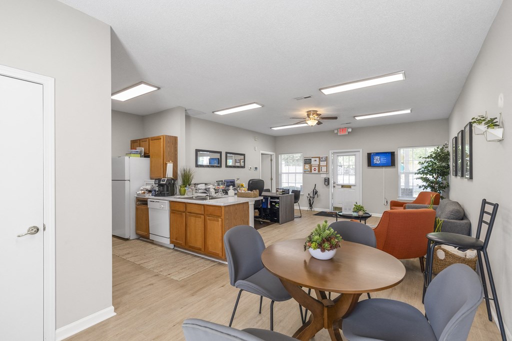 our apartments have a dining room and kitchen with a table and chairs