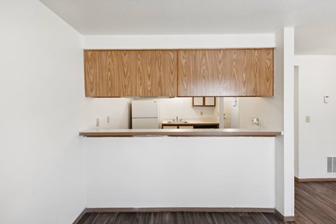 a kitchen with a white wall and a counter top