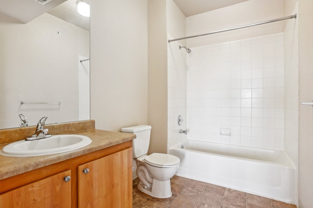 A bathroom with a sink, toilet, and bathtub. at Stetson Meadows Apartments, Colorado Springs, 80922