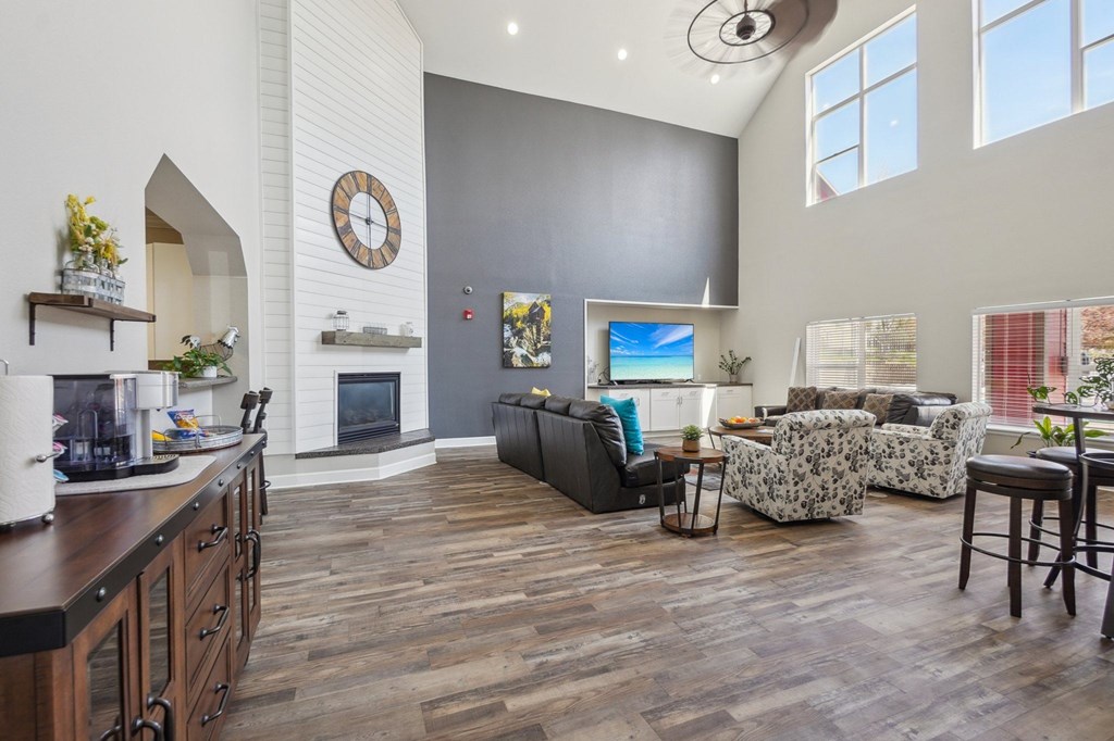 A living room with a fireplace and a couch. at Stetson Meadows Apartments, Colorado Springs, CO