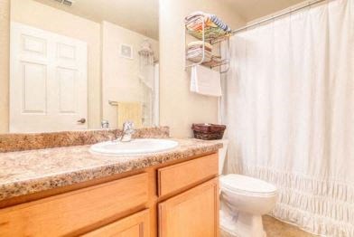 a bathroom with a sink toilet and a shower