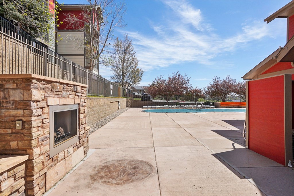 A red garage door is on the right side of the image. at Stetson Meadows Apartments, Colorado