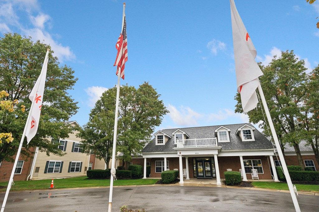 A building with a flag in front of it.
