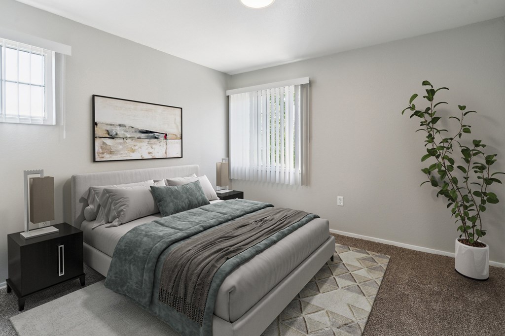 A bedroom with a bed, nightstand, and a plant.