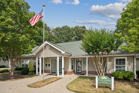 a white building with an flag in front of it