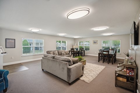 a living room with a couch and a dining room table