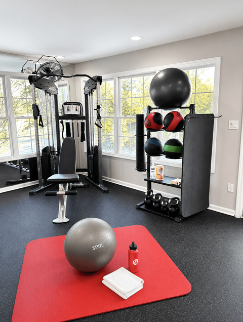 Home gym with exercise equipment and weights at Tanyard Park Apartments, Louisville, 40229