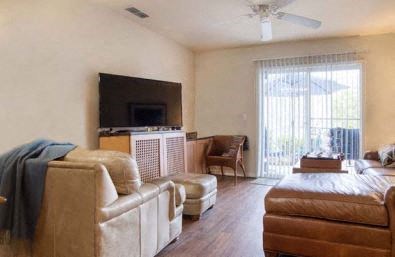 a living room with a couch and a television