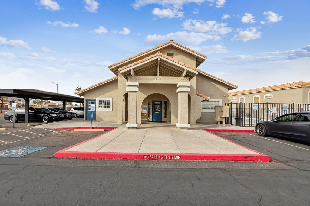 A building with a red "NO FUNNY PLAY FIRE LANE" tape in front of it.