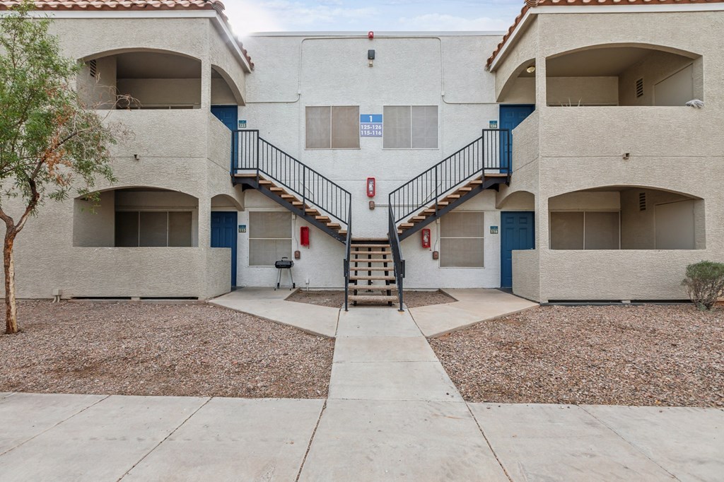 A building with a staircase leading to the second floor.