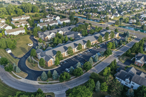 an aerial view of a neighborhood with houses and trees