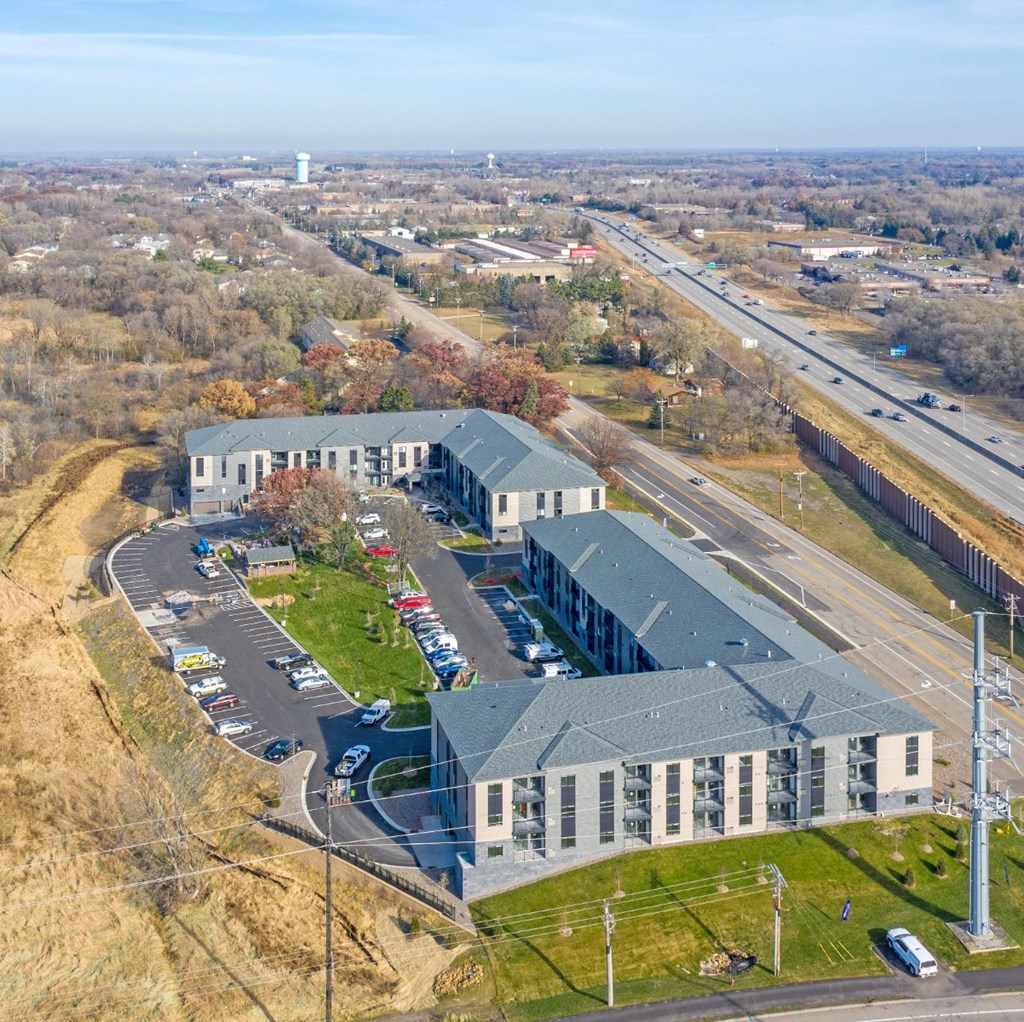 an aerial view of an office building and a parking lot