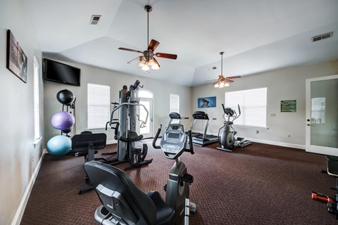 the gym with treadmills and other exercise equipment at 1861 muleshoe road