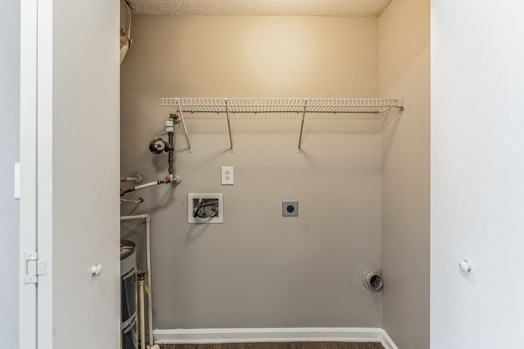 an empty room with a closet and a white wall