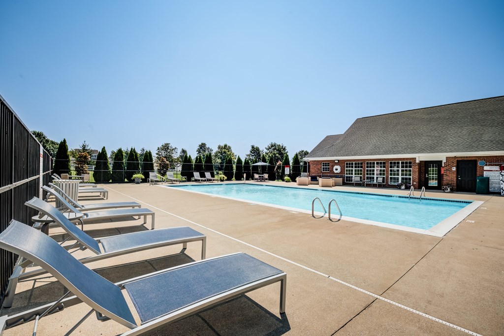 our resort style swimming pool is in front of our building with lounge chairs