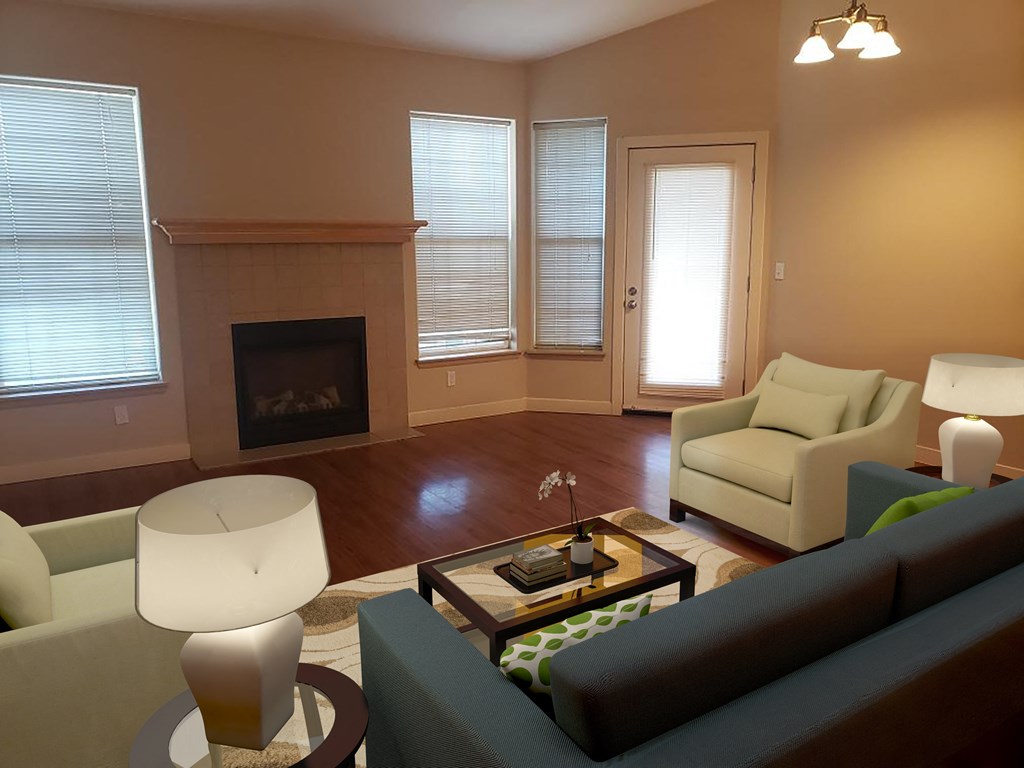 a living room with a fireplace and couches.