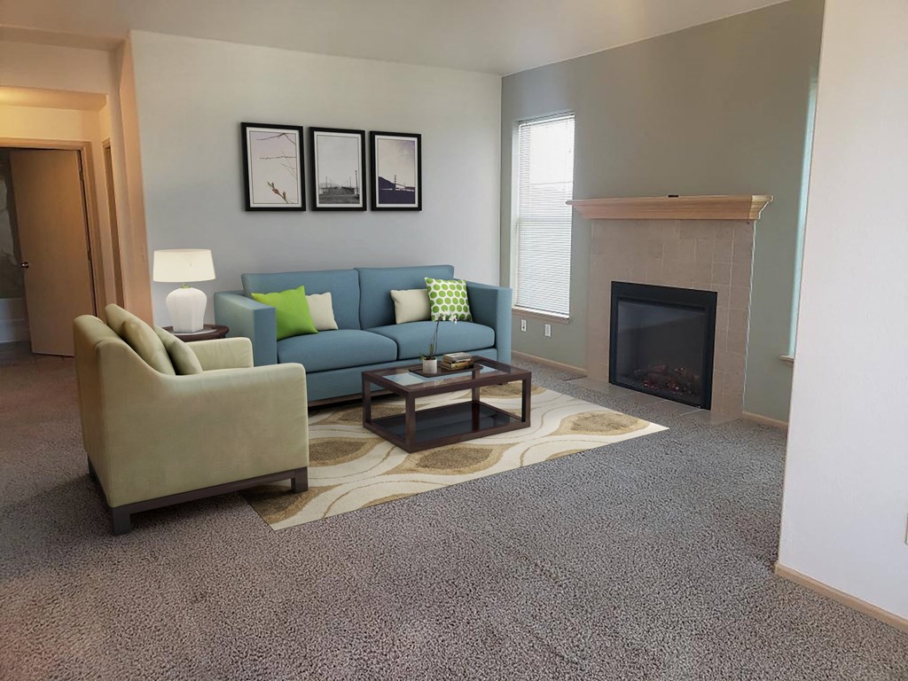 a living room with a fireplace and couches