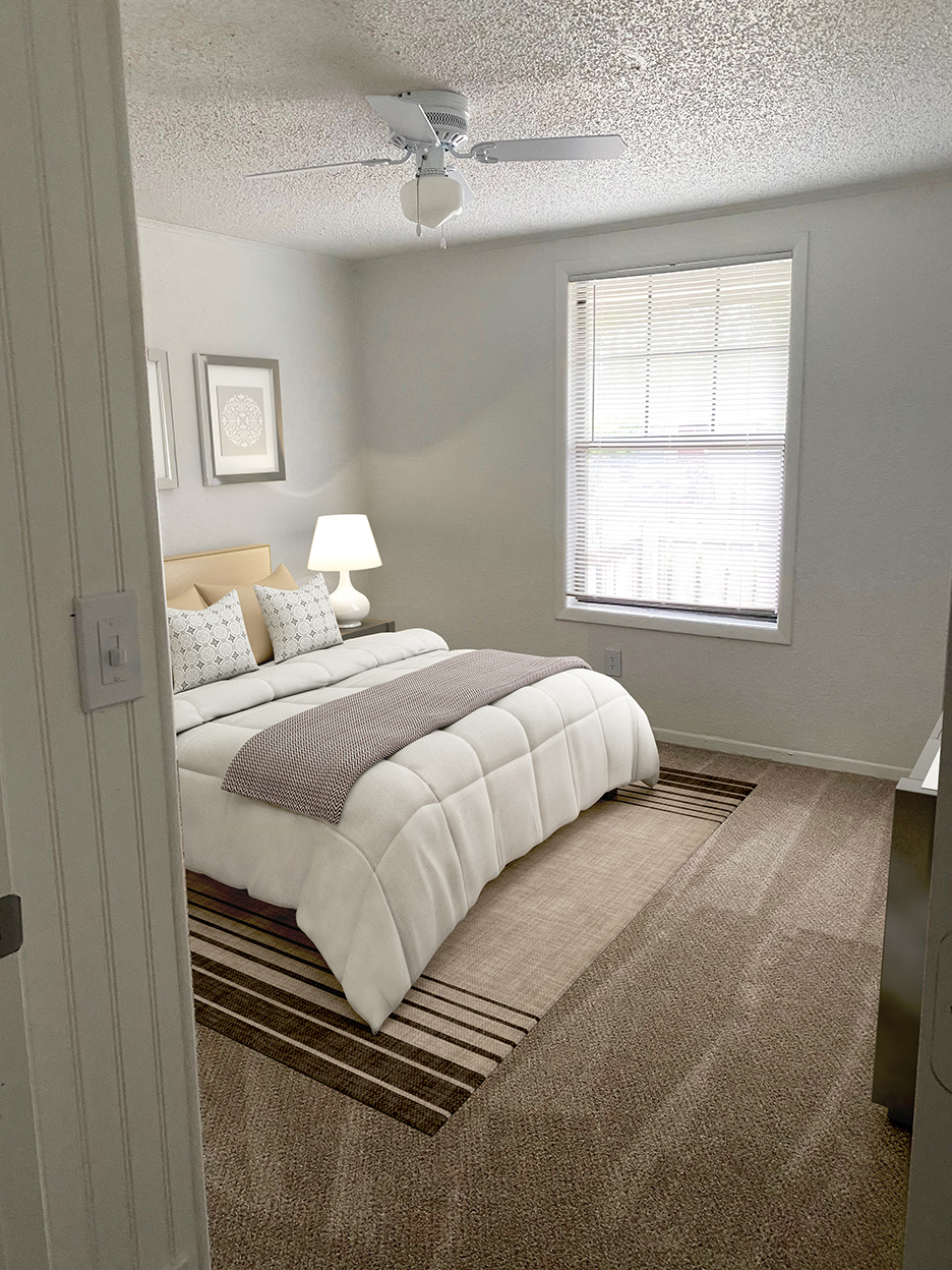 a bedroom with a bed and a window