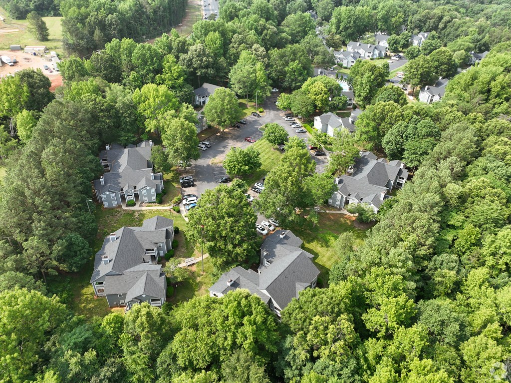 an aerial view of a neighborhood with houses and trees at Delta Crossing, Charlotte, 28212
